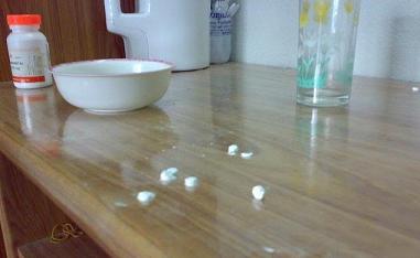 Table with Prescription Bottle and Pills
