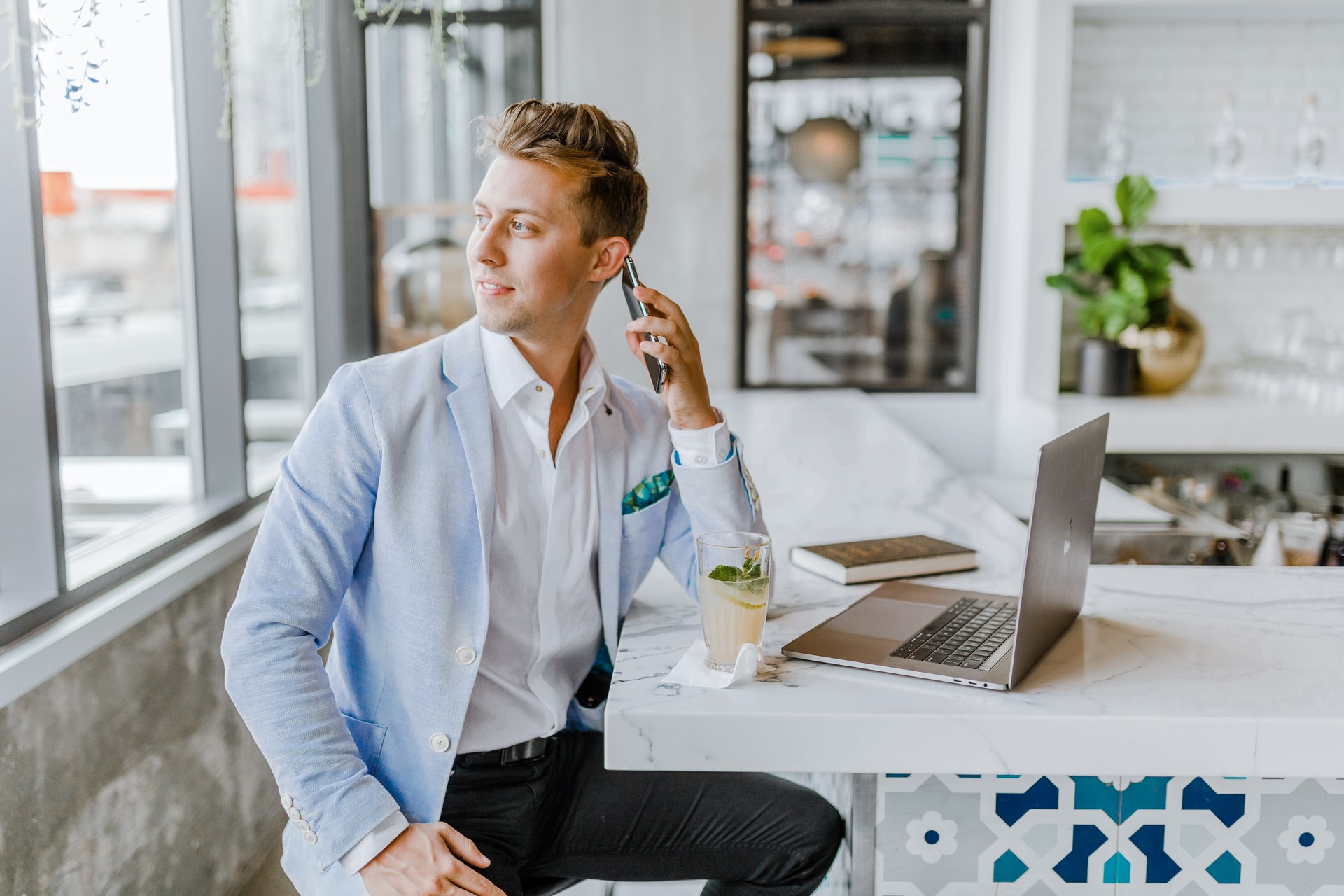 Gentleman in suit on smartphone