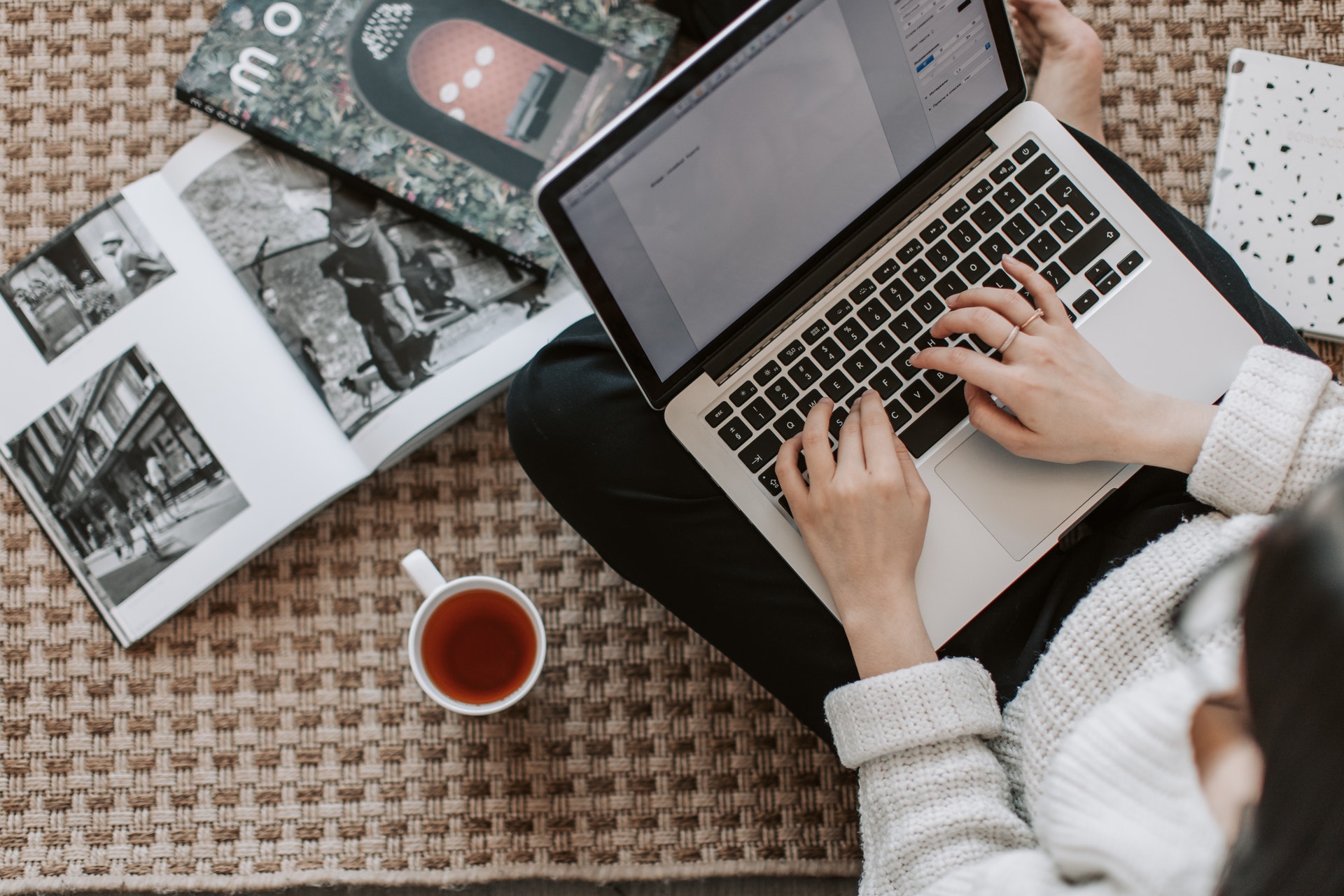 person working on laptop with tea