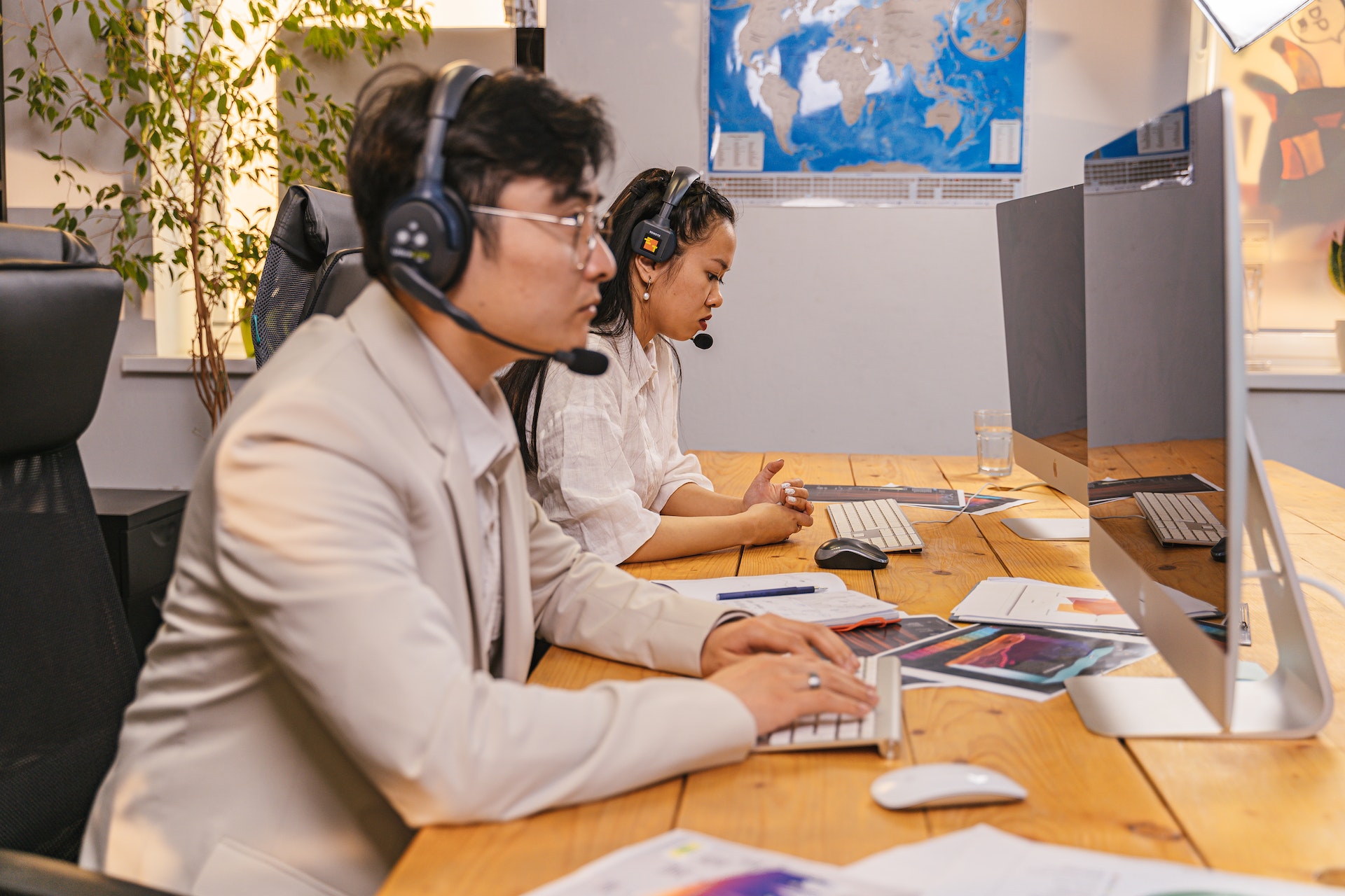 Man and Woman Wearing a Headset with a Microphone in an Office - www.pexels.com