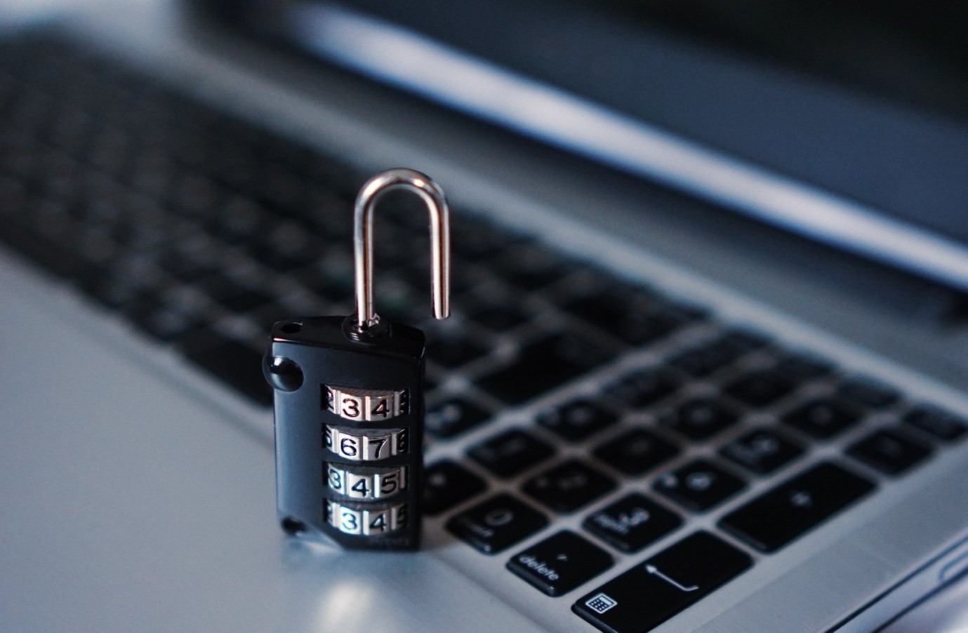 A lock on a computer AI-generated content may be incorrect.
